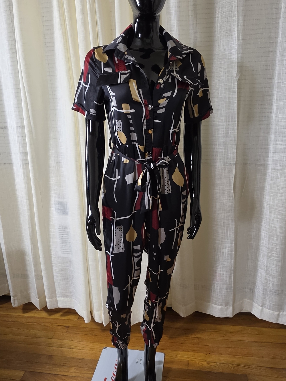 Abstract Print Black Button-Front Jumpsuit with Tie Waist